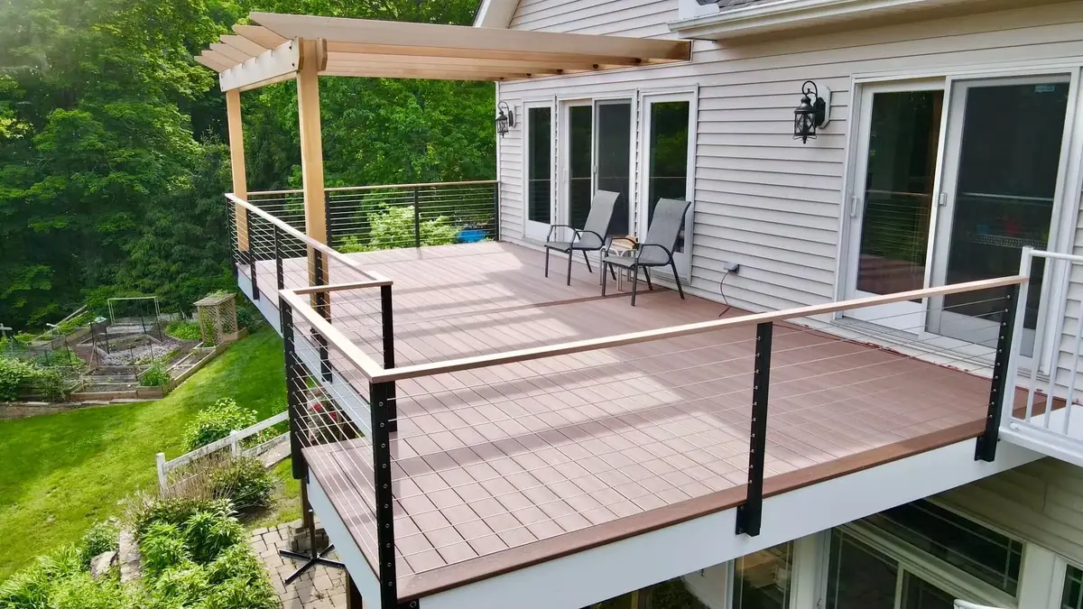 Elevated deck with a pergola overlooking a Westchester County yard